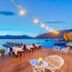 Baldan Suites Hotel & Restaurant in Bozburun, seaside deck dining with sailboats and sunset views