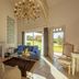 Les Manoirs de Tourgéville in Deauville: elegant suite with fireplace, chandelier and garden view