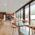 Appart'City Confort Lille Grand Palais breakfast room with tables, chairs and large windows in Lille