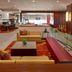 Ottawa Marriott Hotel lobby lounge with sofas, red carpet, dining area and glass railing in Ottawa