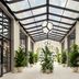 the goodtime hotel, Miami Beach, a Tribute Portfolio Hotel sunlit glass-roof corridor with potted palms