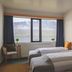 The Cliff Hotel in Neskaupstadur guest room with twin beds and mountain and water views