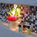 The Sunrise Huraa in Huraa: potted plant and toiletries on a tiled bathroom ledge