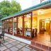 Evergreen Manor and Spa Stellenbosch patio dining area with glassed-in veranda and outdoor seating