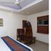 Vishal Hotel Near New Delhi Railway Station room with twin beds, fan, desk and wall-mounted TV in New Delhi