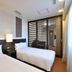Chisun Hotel Koriyama guest room with two single beds and slatted window shutters