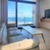 Jeju Oda Pension in Jeju City with ocean-view living room and floor-to-ceiling window