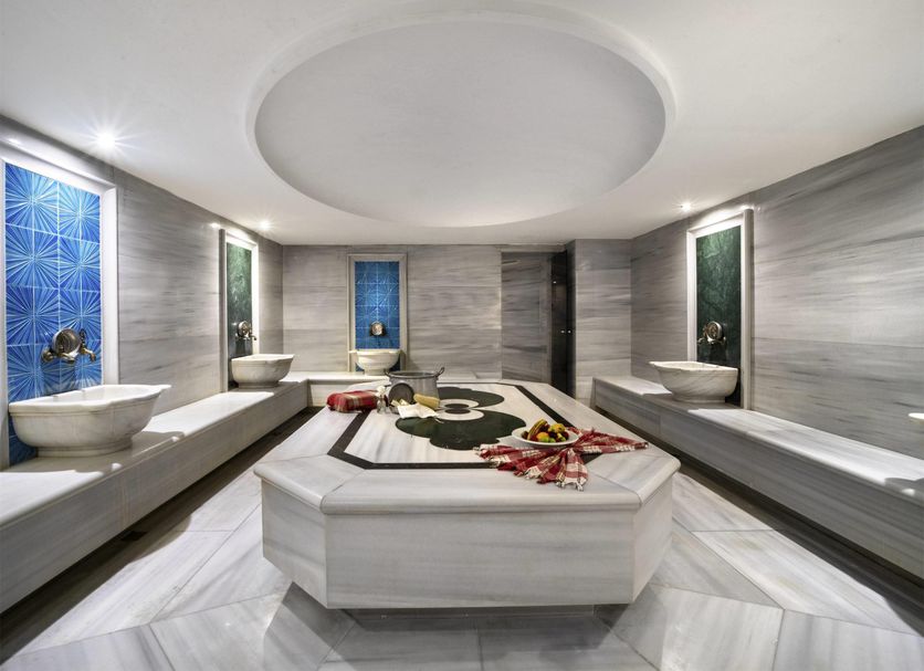Mercure Istanbul Bomonti spa treatment room with massage table and soaking basins, Istanbul