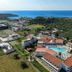 Niriides Beach in Kolympia with a central outdoor pool and sea views from the hillside resort