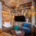 Kopster Hotel Paris Porte de Versailles lounge in Paris with hanging chair, built-in shelves and TV