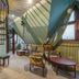 Royal Gdansk in Gdansk: elegant suite with spiral staircase, seating area and skylit sloped ceiling