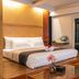 Dang Derm In The Park Khaosan Bangkok bedroom with king bed, balcony doors, and city night view