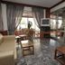 Evans Hotel Heraklion lobby lounge with seating, marble floor and glass entrance