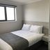 Seabrook Hotel Somerset guest room with double bed, window, and built-in wardrobe