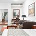 Golden Sands Hotel & Residences in Sharjah: spacious suite with living area, desk, sofa, and bedroom view
