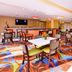 Best Western Plus Fresno Airport Hotel dining area with buffet counter and colorful carpet in Fresno