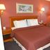 Gulf Towers Resort Motel room in Indian Rocks Beach with king bed, lamps and window AC unit