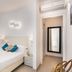 Dimore delle Zagare Ortigia Siracusa guest room with double bed, wall art and mirror