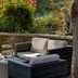 Best Western Sysonby Knoll Hotel terrace seating with wicker chairs and garden views in Melton Mowbray