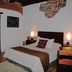 La Ermita de Santa Lucia in Antigua, guest room with bed and private bathroom doorway