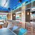 Margaritaville Beach Resort Ft Myers Beach bar with ocean views and blue-accented seating in Fort Myers Beach