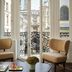 Rosewood Vienna hotel room with French doors opening to Vienna rooftop and city views