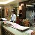 Reception desk at The Unicontinental - Campus Accommodation in Mumbai with staff member and lobby seating