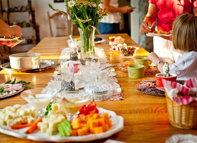 The Inn at Westwynd Farm B&B in Hummelstown dining table with buffet breakfast and guests