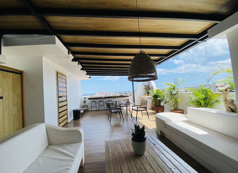 Ocean Breeze Santo Domingo open-air terrace with seating and ocean view