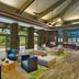 Hilton Garden Inn Kauai Wailua Bay lobby with seating and large windows in Kapaa