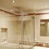 Waldblick Kniebis bathroom with glass shower, sink, bathtub and patterned tile floor in Freudenstadt