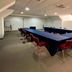 Hotel MX Forum Buenavista Cdmx meeting room in Mexico City with U-shaped conference table and red chairs