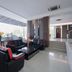 Kenyalang Suite Miri lobby lounge with black leather seating and glass coffee table