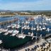 Matador Motor Inn in Coffs Harbour overlooking a marina with sailboats, breakwater and bay views