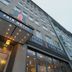 Fair Hotel Europaallee in Frankfurt am Main, exterior entrance with lit canopy and glass facade