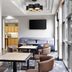 Hyatt Place Atlanta/Alpharetta/North Point Mall lounge with seating, tables and wall-mounted TV in Alpharetta