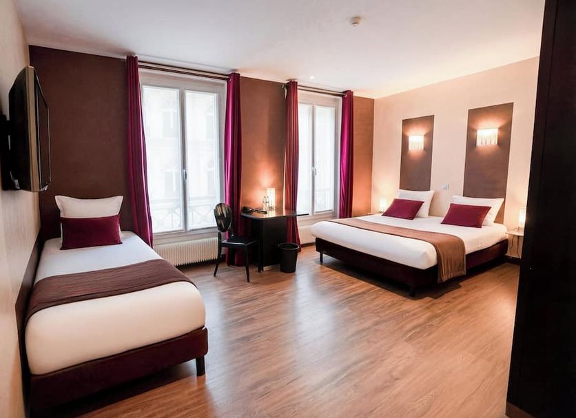 Hotel Pax Opera in Paris room with one single bed, double bed, desk and large windows