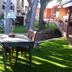 Grand Canyon West Hotel Sheps Miners Inn in Chloride: outdoor patio with table, chairs and grill under a tree