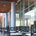 Hampton Inn & Suites by Hilton Aguascalientes Airport outdoor seating area with glass wall and covered terrace