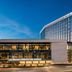 Loews Arlington Hotel in Arlington exterior with Arlington Convention Center and modern glass facade at dusk