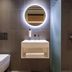 Zedwell Piccadilly Circus bathroom with wall-mounted toilet, illuminated round mirror and vanity, London