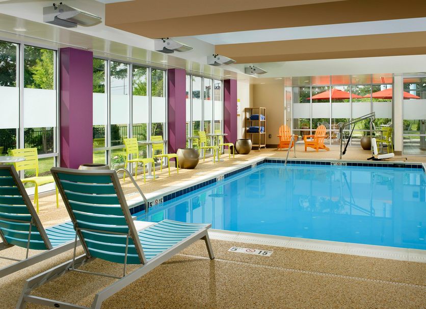 Home2 Suites by Hilton Arundel Mills BWI Airport indoor pool in Hanover with lounge chairs