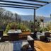 Bryn Melyn Apartments in Barmouth terrace with outdoor seating and mountain and water views