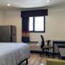 Home Suites in Thief River Falls guest room with bed, desk, chair, mini fridge and window