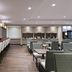 TownePlace Suites by Marriott Naples lobby lounge with bar seating and tables in Naples