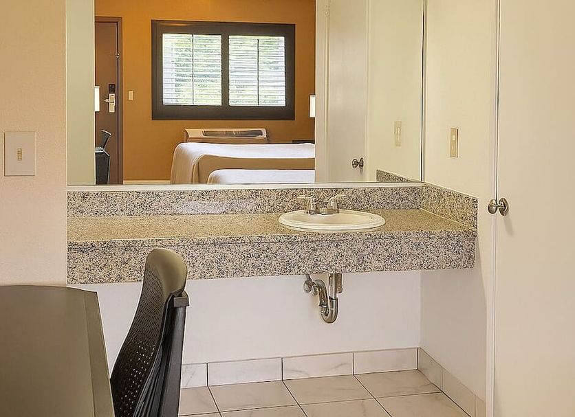 Casa Blanca Hotel - Azusa, Los Angeles room with sink vanity and view into bedroom