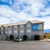 Motel 6 Bernalillo exterior with parking lot and blue sky
