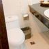 Lvjing International Hotel in Taizhou bathroom with toilet, sink, countertop and shower drain