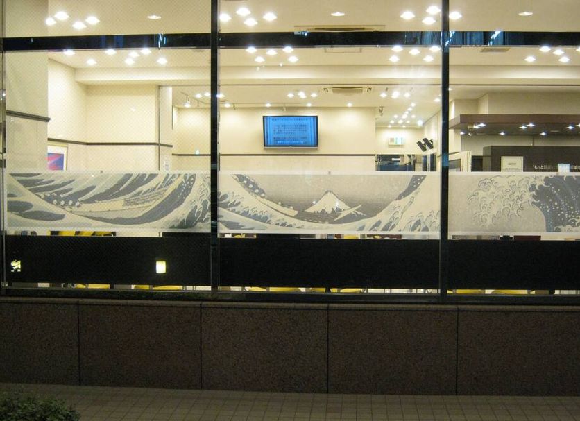 Toyoko Inn Kanda Akihabara in Tokyo lobby with glass wall and wave-pattern frosted design
