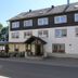 Alpina Löwen Hotel in Sankt Märgen, exterior with entrance and terrace seating